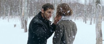 Movie still from “Deadfall” (2012), directed by Stefan Ruzowitzky – A man and a woman in the snow outside; Medium shot, Over the shoulder angle