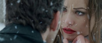 Movie still from “Deadfall” (2012), directed by Stefan Ruzowitzky – A woman looking at a man's reflection in a mirror; Extreme Close Up shot, Over the shoulder angle