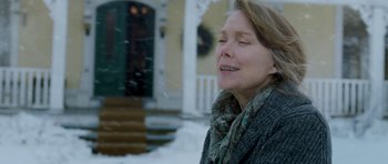 Movie still from “Deadfall” (2012), directed by Stefan Ruzowitzky – An older woman is crying outside in the snow; Close Up shot, Low angle