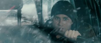 Movie still from “Deadfall” (2012), directed by Stefan Ruzowitzky – A person in a car window; Close Up shot, Over the shoulder angle