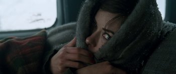 Movie still from “Deadfall” (2012), directed by Stefan Ruzowitzky – A person wearing a coat; Close Up shot, Low angle