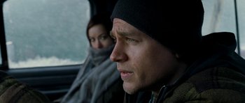 Movie still from “Deadfall” (2012), directed by Stefan Ruzowitzky – A man and a woman sitting in a car; Close Up shot, Over the shoulder angle