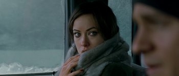 Movie still from “Deadfall” (2012), directed by Stefan Ruzowitzky – A person wearing a fur coat; Close Up shot, High angle
