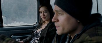 Movie still from “Deadfall” (2012), directed by Stefan Ruzowitzky – A man and a woman sitting in a car; Close Up shot, Over the shoulder angle