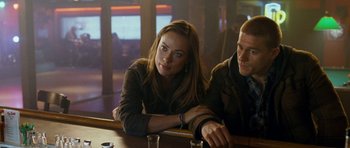 Movie still from “Deadfall” (2012), directed by Stefan Ruzowitzky – A man and a woman sitting at a bar; Medium shot, Over the shoulder angle