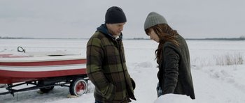 Movie still from “Deadfall” (2012), directed by Stefan Ruzowitzky – A man and a woman standing next to each other in the snow; Medium shot, Over the shoulder angle