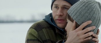 Movie still from “Deadfall” (2012), directed by Stefan Ruzowitzky – A person with a hat on; Close Up shot, Over the shoulder angle