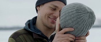 Movie still from “Deadfall” (2012), directed by Stefan Ruzowitzky – A person wearing a hat; Close Up shot, Over the shoulder angle