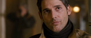 Movie still from “Deadfall” (2012), directed by Stefan Ruzowitzky – A person wearing a sweater and looking at the camera; Close Up shot, Over the shoulder angle