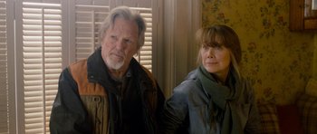 Movie still from “Deadfall” (2012), directed by Stefan Ruzowitzky – A man and a woman standing next to each other; Medium shot, Over the shoulder angle