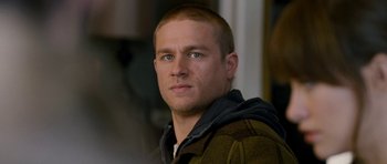 Movie still from “Deadfall” (2012), directed by Stefan Ruzowitzky – A person wearing a jacket; Close Up shot, Over the shoulder angle