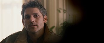 Movie still from “Deadfall” (2012), directed by Stefan Ruzowitzky – A person wearing a jacket; Close Up shot, Over the shoulder angle