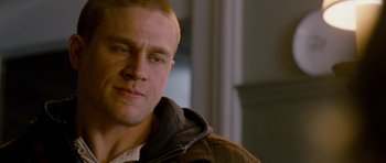 Movie still from “Deadfall” (2012), directed by Stefan Ruzowitzky – A person wearing a jacket; Close Up shot, Over the shoulder angle