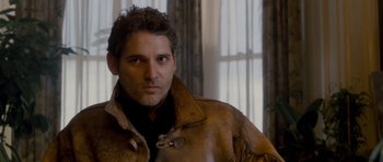 Movie still from “Deadfall” (2012), directed by Stefan Ruzowitzky – A person wearing a leather jacket; Close Up shot, Over the shoulder angle