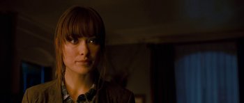 Movie still from “Deadfall” (2012), directed by Stefan Ruzowitzky – A person wearing a jacket; Close Up shot, Over the shoulder angle