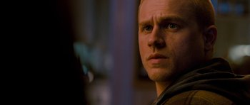 Movie still from “Deadfall” (2012), directed by Stefan Ruzowitzky – A man's face in the dark; Close Up shot, Over the shoulder angle