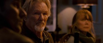 Movie still from “Deadfall” (2012), directed by Stefan Ruzowitzky – An older man with a beard and a mustache; Close Up shot, Over the shoulder angle