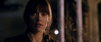 Movie still from “Deadfall” (2012), directed by Stefan Ruzowitzky – A person wearing a plaid shirt; Close Up shot, Over the shoulder angle