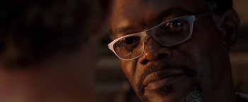 Movie still from “Deep Blue Sea” (1999), directed by Renny Harlin – A person wearing glasses; Close Up shot, Over the shoulder angle