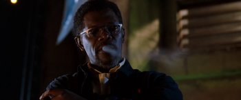 Movie still from “Deep Blue Sea” (1999), directed by Renny Harlin – A person smoking a cigarette; Close Up shot, Low angle