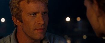 Movie still from “Deep Blue Sea” (1999), directed by Renny Harlin – A man's face at night; Close Up shot, Over the shoulder angle