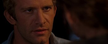Movie still from “Deep Blue Sea” (1999), directed by Renny Harlin – A man's face as he stares into the camera; Close Up shot, Over the shoulder angle