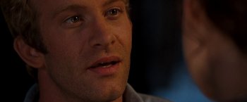 Movie still from “Deep Blue Sea” (1999), directed by Renny Harlin – A man's eyes and face; Close Up shot, Over the shoulder angle
