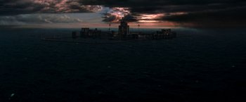 Movie still from “Deep Blue Sea” (1999), directed by Renny Harlin – A large body of water near a large city at night; Extreme Wide shot, High angle