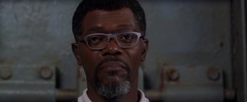 Movie still from “Deep Blue Sea” (1999), directed by Renny Harlin – A person wearing glasses; Close Up shot, Low angle