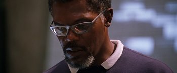 Movie still from “Deep Blue Sea” (1999), directed by Renny Harlin – A person wearing glasses; Close Up shot, Low angle