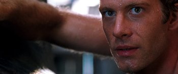 Movie still from “Deep Blue Sea” (1999), directed by Renny Harlin – A man's face with water drops on it; Extreme Close Up shot, Low angle