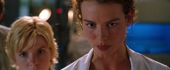 Movie still from “Deep Blue Sea” (1999), directed by Renny Harlin – A person wearing a white shirt; Close Up shot, Low angle