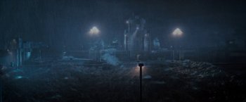 Movie still from “Deep Blue Sea” (1999), directed by Renny Harlin – A view of a city in the rain at night; Extreme Wide shot, High angle