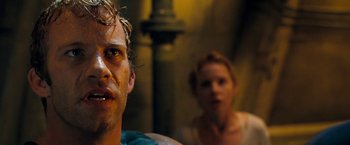 Movie still from “Deep Blue Sea” (1999), directed by Renny Harlin – A man and a woman are looking at the camera; Close Up shot, Low angle
