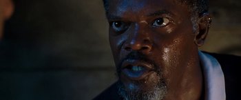 Movie still from “Deep Blue Sea” (1999), directed by Renny Harlin – A man's eyes and face; Close Up shot, Low angle