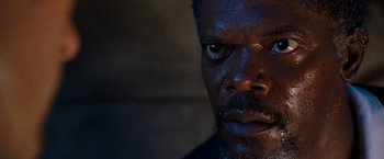 Movie still from “Deep Blue Sea” (1999), directed by Renny Harlin – A man's face in the dark; Close Up shot, Low angle