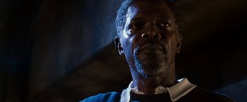 Movie still from “Deep Blue Sea” (1999), directed by Renny Harlin – A person with a beard; Close Up shot, Low angle