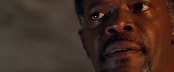 Movie still from “Deep Blue Sea” (1999), directed by Renny Harlin – A man's eyes and face; Extreme Close Up shot, Low angle