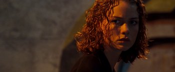 Movie still from “Deep Blue Sea” (1999), directed by Renny Harlin – A person with curly red hair; Close Up shot, Low angle
