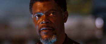 Movie still from “Deep Blue Sea” (1999), directed by Renny Harlin – A person with a beard looking at the camera; Close Up shot, Low angle