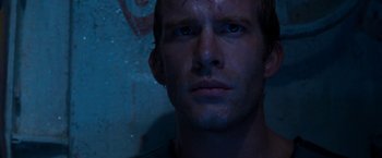 Movie still from “Deep Blue Sea” (1999), directed by Renny Harlin – A man's face in the dark; Close Up shot, Low angle