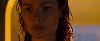 Movie still from “Deep Blue Sea” (1999), directed by Renny Harlin – A woman's face in the dark; Close Up shot, Low angle