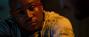 Movie still from “Deep Blue Sea” (1999), directed by Renny Harlin – A man's face with blood on his face; Close Up shot, High angle