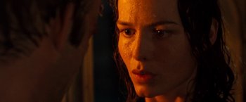 Movie still from “Deep Blue Sea” (1999), directed by Renny Harlin – A woman's face in the dark; Close Up shot, Over the shoulder angle