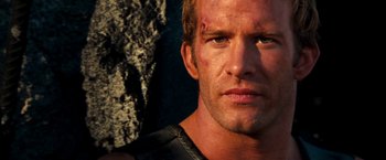 Movie still from “Deep Blue Sea” (1999), directed by Renny Harlin – A man that is looking into the camera; Close Up shot, Low angle