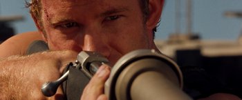 Movie still from “Deep Blue Sea” (1999), directed by Renny Harlin – A person holding a camera; Close Up shot, Over the shoulder angle