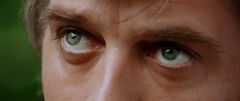 Movie still from “Deep Red” (1975), directed by Dario Argento – View of a person's eyes with green eyes; Extreme Close Up shot, Overhead angle