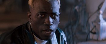 Movie still from “Demolition Man” (1993), directed by Marco Brambilla – A person wearing a jacket; Close Up shot, High angle