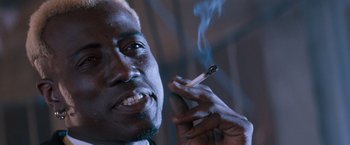 Movie still from “Demolition Man” (1993), directed by Marco Brambilla – A person smoking a cigarette; Close Up shot, Low angle