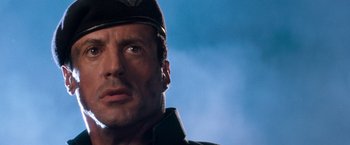 Movie still from “Demolition Man” (1993), directed by Marco Brambilla – A person wearing a hat; Close Up shot, Low angle